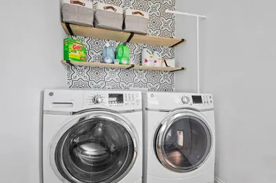 a laundry room with a washer and dryer at Pool House Retreat near LAX, SoFi & Beach in Inglewood