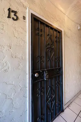 a black door on the side of a building at Sleek Studio Near Downtown LA • AC • WiFi • Snacks in Los Angeles