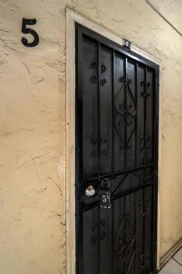 a black door on the side of a building at Cozy Studio Near Downtown LA with AC WiFi and Snacks in Los Angeles