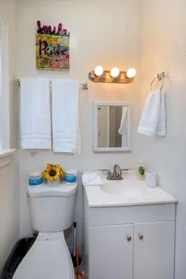 a bathroom with a white toilet and a sink at Cozy Studio Near Downtown LA with AC WiFi and Snacks in Los Angeles