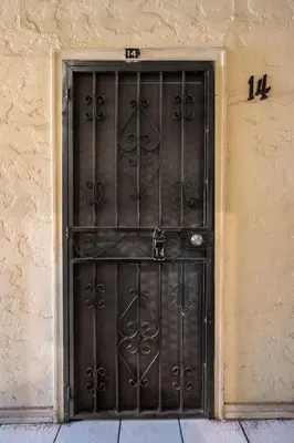 a black door on the side of a building at Lovely Studio Near Downtown LA with AC WiFi and Snacks in Los Angeles