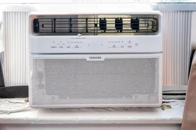a white microwave oven sitting on a table at Lovely Studio Near Downtown LA with AC WiFi and Snacks in Los Angeles