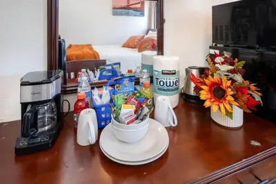 a table with a coffee maker and a cup of coffee at Lovely Studio Near Downtown LA with AC WiFi and Snacks in Los Angeles