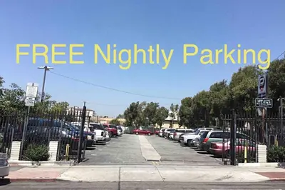 a sign that reads free mighty parking in a parking lot at Lovely Studio Near Downtown LA with AC WiFi and Snacks in Los Angeles