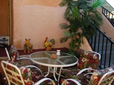 a room with a table and chairs and a tree at Charming Studio Near DTLA AC WiFi Snacks in Los Angeles