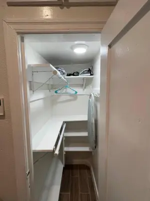 an empty closet with shelves and a hallway at Charming Studio Near DTLA AC WiFi Snacks in Los Angeles