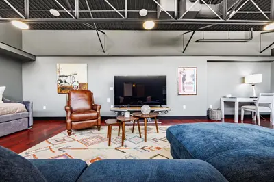 a living room with a couch and a tv at Long Beach Apartment - 10 Min Walk to the Beach! in Long Beach