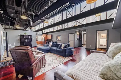 a large living room with a couch and chairs at Long Beach Apartment - 10 Min Walk to the Beach! in Long Beach