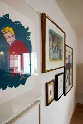 a group of pictures hanging on a wall at Lalaland Bungalow in Burbank