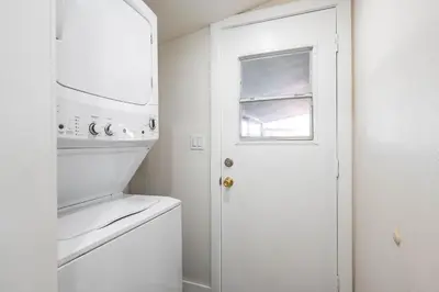 a white kitchen with a stove and a white door at Foothills LA Hideaway Patio Lounge Work-Friendly in Glendora