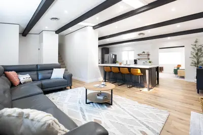 a living room with a couch and a kitchen at Bear Mountain Getaway in Big Bear Lake