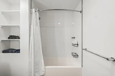 a shower with a shower curtain in a bathroom at Cozy Beachside Escape with Great Views in Long Beach