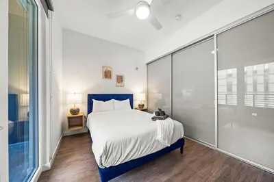 a bedroom with a bed and a sliding glass door at Cozy Beachside Escape with Great Views in Long Beach