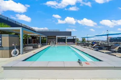 a swimming pool on the roof of a building at Cozy Beachside Escape with Great Views in Long Beach
