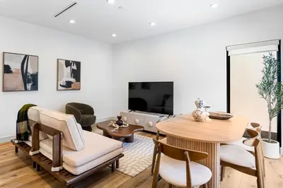 a living room with a table and chairs at Luna View LA in Los Angeles