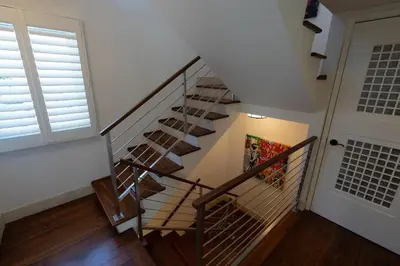 a spiral staircase in a house with a door at Venice Beach Townhouse in Los Angeles