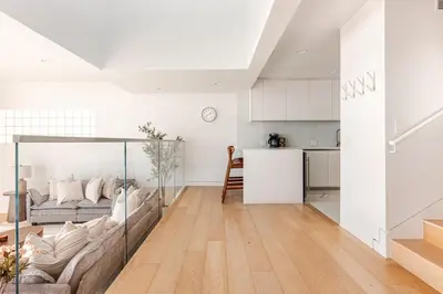 a living room with a couch and a kitchen at Gorgeous Malibu Retreat with #Instaworthy Ocean Views in Malibu Beach