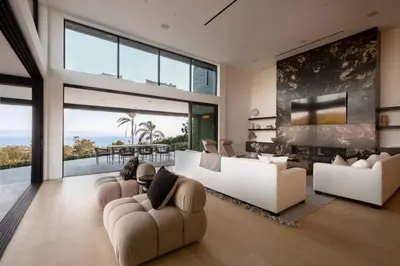 a living room with white furniture and large windows at Malibu Coastal Paradise with Pool, Spa and Tennis Court in Malibu