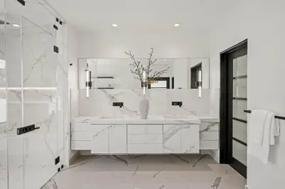 a white bathroom with a sink and a mirror at Prestigious 6BR BH Mansion W. Pool, Theatre, Views in Los Angeles