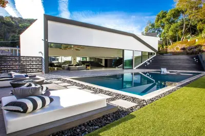 a house with a swimming pool in the yard at Beverly Hills Luxurious 4BR Villa with Pool and Views in Los Angeles