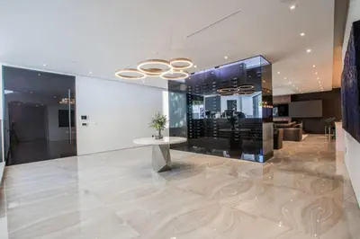 a lobby with a table in a building at Beverly Hills Luxurious 4BR Villa with Pool and Views in Los Angeles