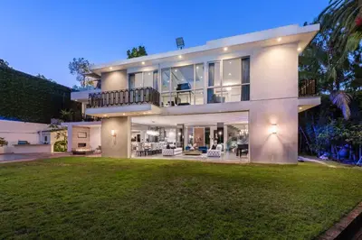 a large white mansion with a large yard at Royalty Villa in Beverly Hills in Los Angeles
