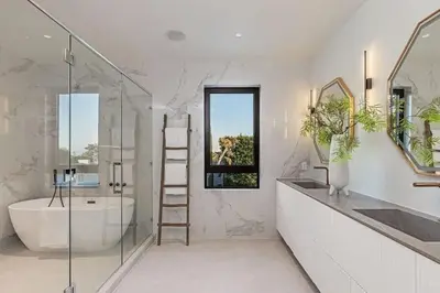 a bathroom with a tub and a sink and a ladder at Sunset Plaza Luxury Masterpiece Villa in Los Angeles