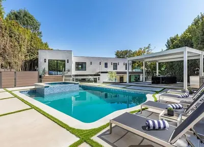 an exterior view of a house with a swimming pool at Sunset Plaza Luxury Masterpiece Villa in Los Angeles
