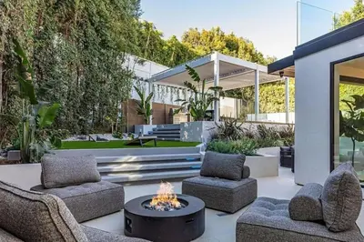 a patio with two chairs and a fire pit at Sunset Plaza Luxury Masterpiece Villa in Los Angeles