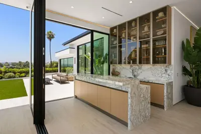 an open kitchen with a view of a house at Ultra Luxurious 5BR Villa W. Pool, Jacuzzi, Views in Los Angeles