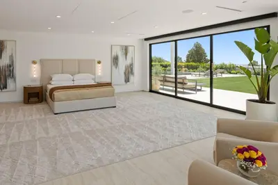 a bedroom with a bed and a large window at Ultra Luxurious 5BR Villa W. Pool, Jacuzzi, Views in Los Angeles