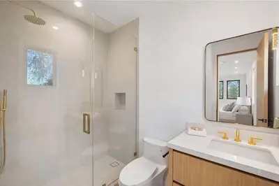 a bathroom with a shower and a toilet and a sink at Stunning 5BR in Studio City W. Pool, and Jacuzzi in Los Angeles