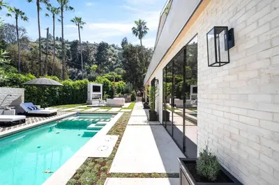 a swimming pool in the backyard of a house at Stunning 6BR Laurel Canyon Estate with Pool and Jacuzzi in Los Angeles