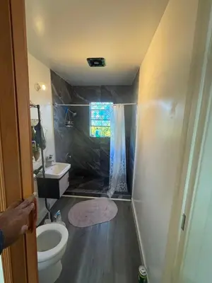 a small bathroom with a toilet and a sink at 262 Coronado ave in Long Beach