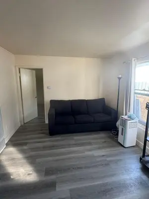 a living room with a couch and a window at 262 Coronado ave in Long Beach