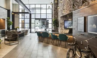 a room with chairs and a table in a building at Modern Serenity Apartment for a Comfortable Stay in Glendale