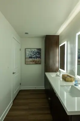 a white bathroom with two sinks and a mirror at Cozy and Calm Retreat in Heart of Glendale in Glendale