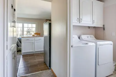 a kitchen with white cabinets and a refrigerator at Cozy 1BR Guest House with Mountain View in Simi Valley in Simi Valley