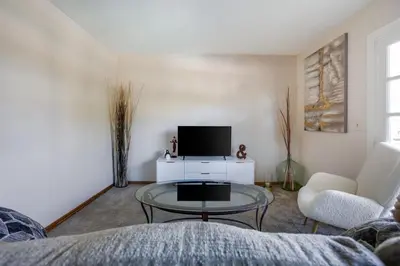 a living room with a tv and a table and chairs at Cozy 1BR Guest House with Mountain View in Simi Valley in Simi Valley