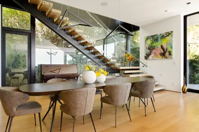 a dining room with a table and chairs at Belfast Estate in Los Angeles