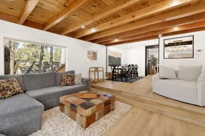 a living room with a couch and a table at Vista Pines at Big Bear Lake– Your Ultimate Mountain Escape in Big Bear Lake