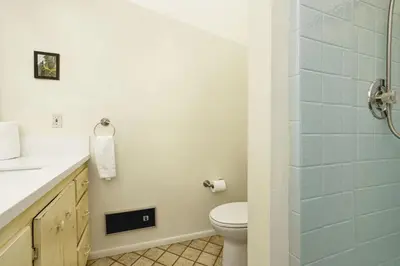 a bathroom with a toilet and a glass shower at Pleasant Pause Family Retreat in Big Bear Lake in Fawnskin