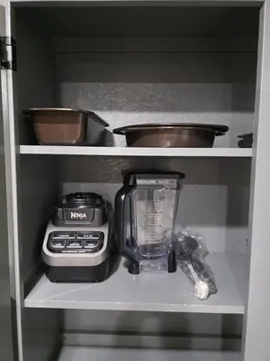 a kitchen cabinet with a blender and a blenderventory at Newly Listed Family Friendly Fontana House in Fontana
