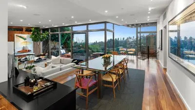 a living room with a table and chairs at Waynecrest in Los Angeles