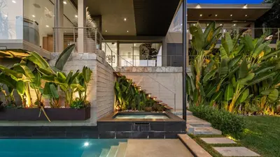 a house with a swimming pool in front of a house at Waynecrest in Los Angeles