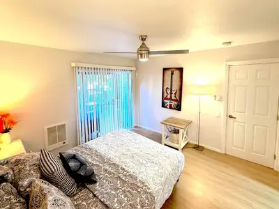 a bedroom with a bed and a table and a window at Great 2 Bedroom and 2 Bathroom Apartment in Marina in Los Angeles