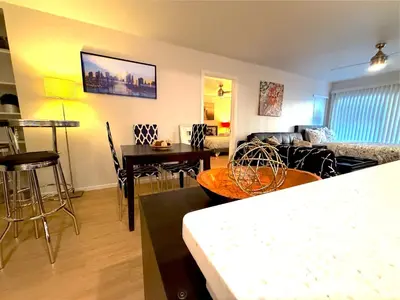 a living room with a couch and a table at Great 2 Bedroom and 2 Bathroom Apartment in Marina in Los Angeles