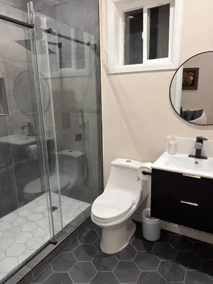 a bathroom with a shower and a toilet and a sink at Perfect and relaxing Couple retreat in the heart of Los Angeles in Los Angeles