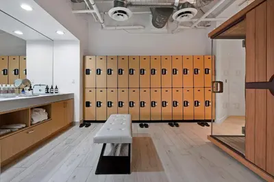 a locker room with lockers and a bench in it at Aquareve in Malibu Beach