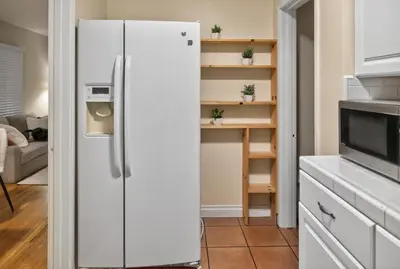 a white refrigerator in a kitchen with shelves at Luxury Cozy 2BR 1BA near LAX, LMU, SoFi Stadium, Beach in Los Angeles